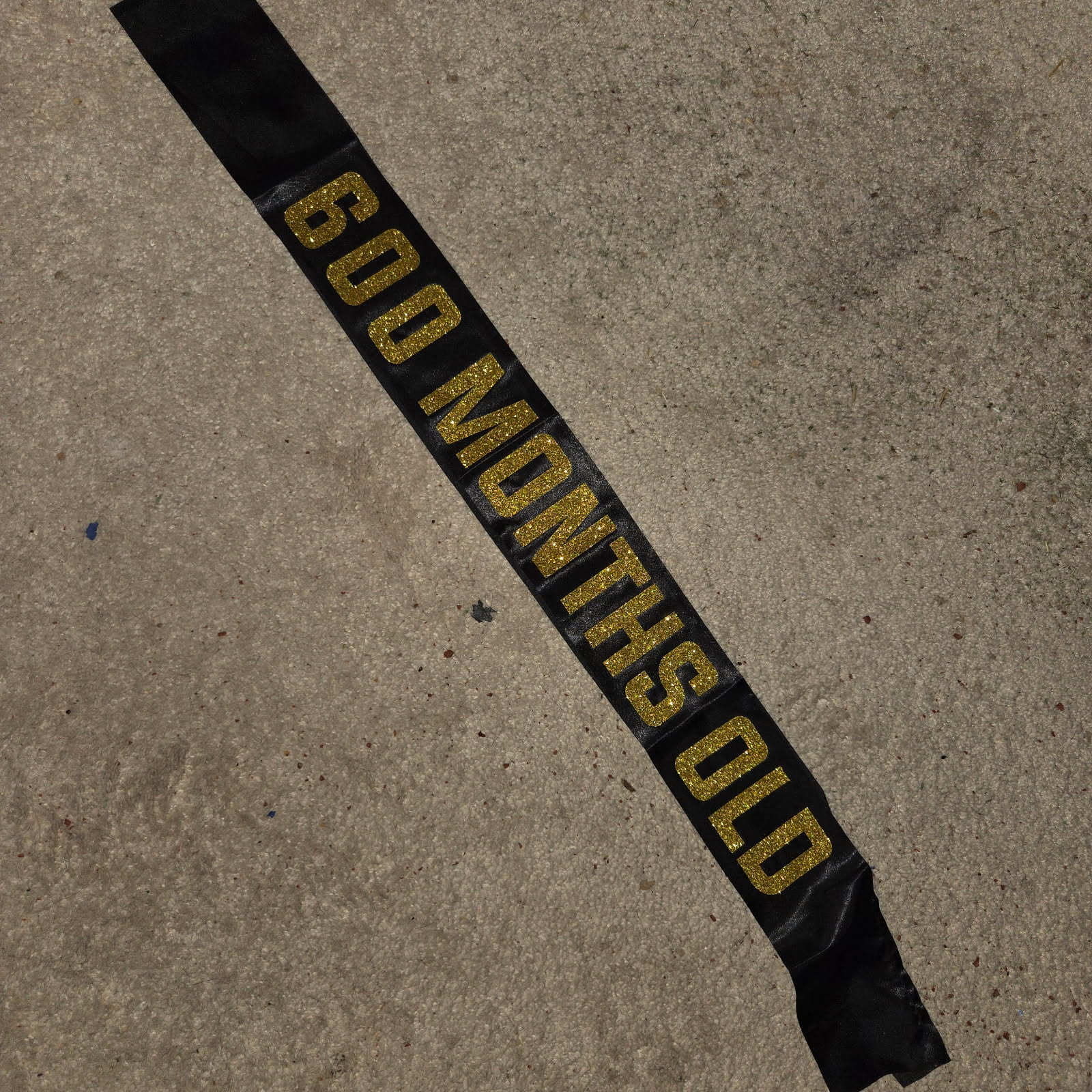 Sterling James Co. 600 Months Old Black & Gold Glitter Sash